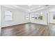 Spacious bedroom featuring lots of natural light and hardwood floors at 37252 Clinch Cir, Zephyrhills, FL 33540