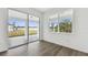 Bedroom with a sliding glass door providing access to the backyard at 37252 Clinch Cir, Zephyrhills, FL 33540