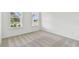 Bedroom featuring two windows and carpet flooring at 37252 Clinch Cir, Zephyrhills, FL 33540