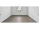 Bedroom featuring wood flooring and white walls at 37252 Clinch Cir, Zephyrhills, FL 33540