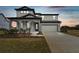 Charming two-story home with a covered porch and two-car garage at 37252 Clinch Cir, Zephyrhills, FL 33540