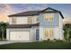 Charming two-story home with a two car garage and beautifully landscaped front yard at 37252 Clinch Cir, Zephyrhills, FL 33540