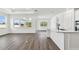 Bright and spacious living area featuring lots of natural light and hardwood floors at 37252 Clinch Cir, Zephyrhills, FL 33540