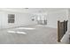 Open loft area featuring carpet flooring and natural light at 37252 Clinch Cir, Zephyrhills, FL 33540