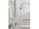 Bright shower featuring a glass door and white tile at 37252 Clinch Cir, Zephyrhills, FL 33540