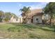 View of the home's exterior with lawn, landscaping, and neutral color palette at 404 Craft Rd, Brandon, FL 33511