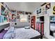 Quirky bedroom with colorful wall art, terrazzo floors, and a vibrant color palette at 4108 Berkley Dr, Tampa, FL 33610