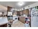 Spacious kitchen featuring wood cabinets, a breakfast bar, and an open layout at 4108 Berkley Dr, Tampa, FL 33610