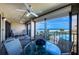 Relaxing balcony featuring coastal views, ceiling fans, and outdoor seating at 4450 Gulf Blvd # 303, St Pete Beach, FL 33706