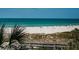 Picturesque beach scene with people enjoying the sun and surf, a beautiful view at 4450 Gulf Blvd # 303, St Pete Beach, FL 33706