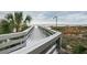 Scenic boardwalk leading to the beach with lush vegetation alongside, offering a tranquil path to the sandy shores at 4450 Gulf Blvd # 303, St Pete Beach, FL 33706