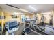 Fully-equipped fitness center with treadmills, stationary bikes, and a weight training machine at 4450 Gulf Blvd # 303, St Pete Beach, FL 33706