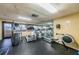 Well-equipped gym with treadmills, stationary bikes, and a mirrored wall for workouts at 4450 Gulf Blvd # 303, St Pete Beach, FL 33706