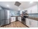 Bright kitchen features stainless steel appliances, sleek cabinetry, and modern countertops at 4450 Gulf Blvd # 303, St Pete Beach, FL 33706