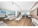Open floor plan featuring lounge area, dining area, and direct access to kitchen at 4450 Gulf Blvd # 303, St Pete Beach, FL 33706