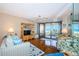 Cozy living room with balcony offering stunning ocean views, perfect for relaxing at 4450 Gulf Blvd # 303, St Pete Beach, FL 33706