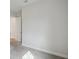 An empty bedroom with gray carpet, white walls and a door at 4535 Foley Grove Dr, Valrico, FL 33596