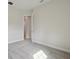 Bedroom featuring neutral carpet and open door to walk-in closet at 4535 Foley Grove Dr, Valrico, FL 33596