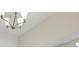 Close up of dining room with chandelier lighting and ceiling trim at 4535 Foley Grove Dr, Valrico, FL 33596