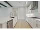Modern kitchen with white cabinetry, stainless steel appliances, and a central island at 4535 Foley Grove Dr, Valrico, FL 33596