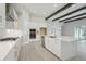 Bright, eat-in kitchen featuring a large island, stainless appliances, and wood-look tile flooring at 4535 Foley Grove Dr, Valrico, FL 33596