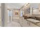Bright bathroom featuring a shower, tub and double vanity with granite countertops at 4579 Del Sol S Blvd, Sarasota, FL 34243