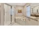 Bathroom featuring glass shower, soaking tub, tile floors, and granite countertops at 4579 Del Sol S Blvd, Sarasota, FL 34243