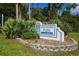 Longwood Park community sign with mature landscaping and a park address at 4579 Del Sol S Blvd, Sarasota, FL 34243