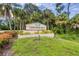 Entrance to Longwood Run, a beautiful and well-maintained community with mature trees at 4579 Del Sol S Blvd, Sarasota, FL 34243