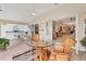 Bright Florida room with a ceiling fan, rattan furniture, and views at 4579 Del Sol S Blvd, Sarasota, FL 34243