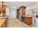 Well-appointed kitchen with stainless steel appliances, an island with seating, and ample cabinet space at 4579 Del Sol S Blvd, Sarasota, FL 34243