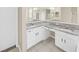 This elegant bathroom features dual sinks, granite countertops, and ample counter space for your convenience at 4644 Braesgate Ct, Land O Lakes, FL 34639