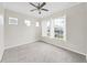Serene bedroom with neutral carpet, crown molding, and an abundance of natural light from windows at 4644 Braesgate Ct, Land O Lakes, FL 34639
