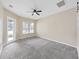 Comfortable and spacious bedroom featuring neutral colors and a ceiling fan for added comfort and relaxation at 4644 Braesgate Ct, Land O Lakes, FL 34639