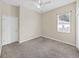 Neutral bedroom featuring carpet, a ceiling fan, and closet at 4644 Braesgate Ct, Land O Lakes, FL 34639