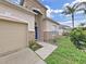 Gorgeous home with a stone and stucco front, beautiful landscaping, and a blue front door at 4644 Braesgate Ct, Land O Lakes, FL 34639