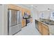 Modern kitchen featuring stainless steel appliances, granite countertops, and tile backsplash at 4644 Braesgate Ct, Land O Lakes, FL 34639