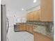 Well-equipped kitchen featuring granite countertops, stainless steel appliances, and ample cabinet space at 4644 Braesgate Ct, Land O Lakes, FL 34639