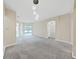 Spacious living room with neutral tones and lots of natural light perfect for relaxing or entertaining guests at 4644 Braesgate Ct, Land O Lakes, FL 34639