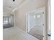 Open-concept living area with ceramic tile flooring and elegant archways throughout the home at 4644 Braesgate Ct, Land O Lakes, FL 34639