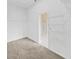 Walk-in closet with wire shelving and gray carpet, featuring an ensuite bath through the doorway at 4644 Braesgate Ct, Land O Lakes, FL 34639