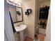 Cozy bathroom with a pedestal sink and essential fixtures at 5034 Terrace Village Ln, Tampa, FL 33617