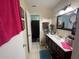 Standard bathroom with a dark wood vanity and a separate toilet and shower room at 5034 Terrace Village Ln, Tampa, FL 33617