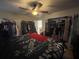 Bedroom featuring a ceiling fan and an open closet, and some clutter at 5034 Terrace Village Ln, Tampa, FL 33617