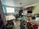 Bedroom featuring a large window and custom desk and shelf areas at 5034 Terrace Village Ln, Tampa, FL 33617