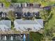 Aerial view of waterfront condos, private boat docks, parking area and lush landscaping at 5075 Starfish Se Dr # B, St Petersburg, FL 33705