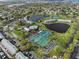 Aerial shot showcasing community amenities including tennis courts, swimming pools and scenic ponds at 5075 Starfish Se Dr # B, St Petersburg, FL 33705