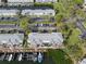 An aerial shot of waterfront condominiums with private boat slips, offering a coastal living experience at 5075 Starfish Se Dr # B, St Petersburg, FL 33705