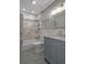 Bathroom featuring a shower-tub combination, vanity with storage and tile flooring at 5075 Starfish Se Dr # B, St Petersburg, FL 33705
