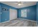 Bedroom has wood-look flooring and a large window with natural light at 5075 Starfish Se Dr # B, St Petersburg, FL 33705